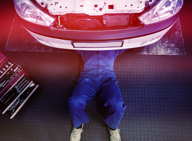 A person underneath a vehicle